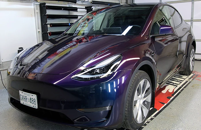 Model Y wrapped in colour flip vinyl Deep Space